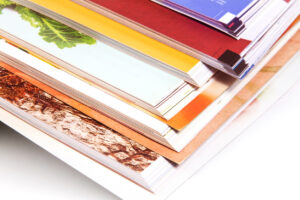 X-Press OnDemand stack of colorful magazines